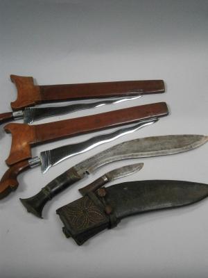 A pair of 20thC Kris and Khukri knife sets (small knife missing).