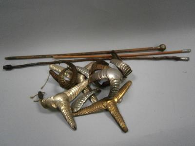 Vintage fireman's shoulder boards and three swagger sticks.
