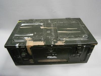 *A green shell case and blue cash tin.