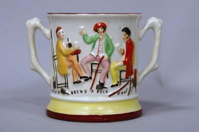 A Victorian pottery tavern and frog loving tankard