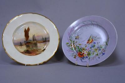 A hand painted cabinet plate depicting fishing boats in harbour