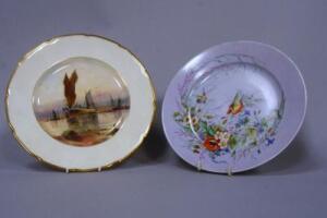 A hand painted cabinet plate depicting fishing boats in harbour