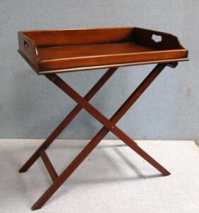 A reproduction Georgian style butlers tray on folding stand.