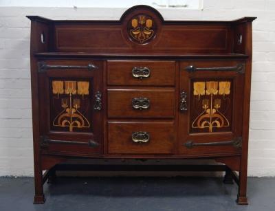 An Art Nouveau mahogany sideboard