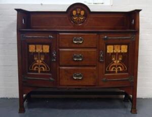 An Art Nouveau mahogany sideboard