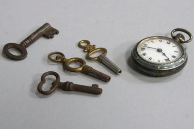 A small silver ladies fob watch with grey