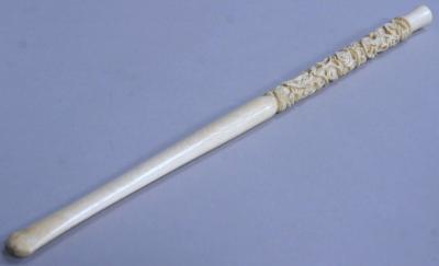 A carved ivory long length cigarette holder