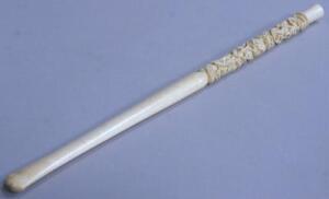 A carved ivory long length cigarette holder
