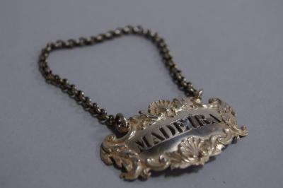 A George III silver decanter label