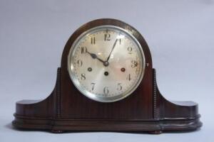 A 1920s mahogany Napoleon hat mantel clock