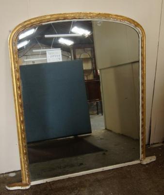 A large Victorian arched top overmantel mirror