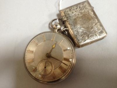 A Victorian silver open faced pocket watch and a silver vesta.