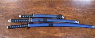 A graduated set of reproduction Japanese Katana swords.
