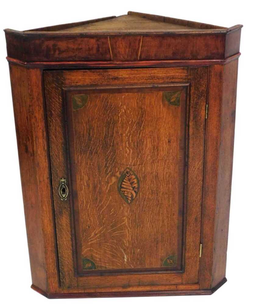 - A George III oak hanging corner cupboard, with oval shell patera ...
