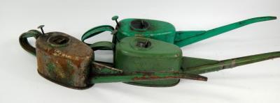 Three vintage oil cans.