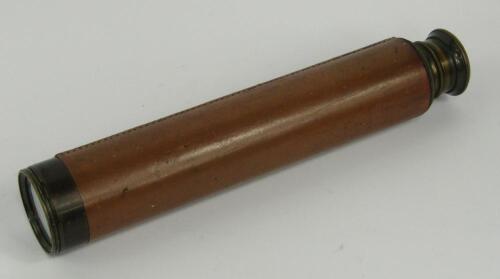 A brass and leather bound four draw telescope, 83cm long extended.