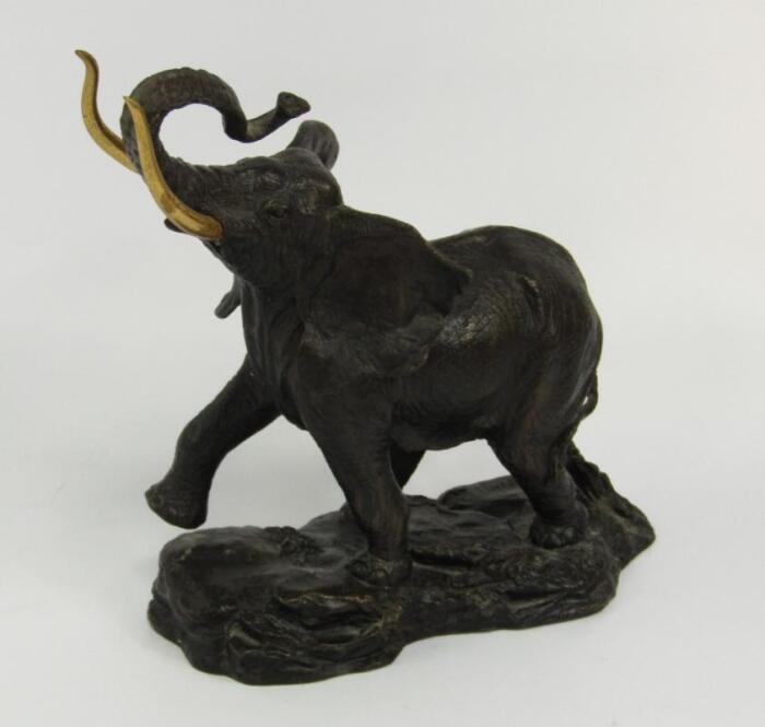 A Franklin Mint bronzed sculpture of an elephant