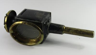 A Victorian tin and brass carriage lamp