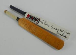 Two miniature cricket bats