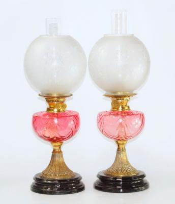 A pair of Duplex brass oil lamps