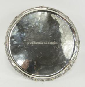 A Continental white metal circular salver