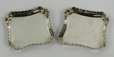 A pair of Victorian silver square trinket dishes