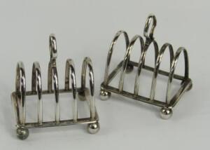 A pair of George V silver four division toast racks