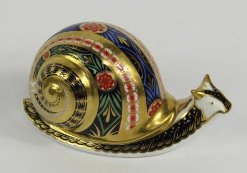 A Royal Crown Derby Imari porcelain paperweight modelled as the Garden Snail
