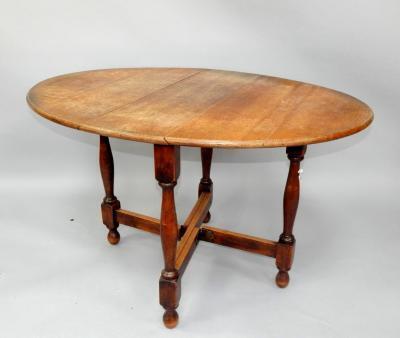 A 19thC oak gateleg dining table