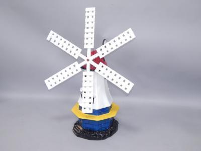 A painted garden windmill ornament