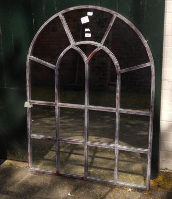 A modern architectural arch mirror