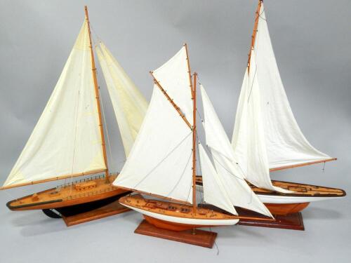 Three model sailing boats