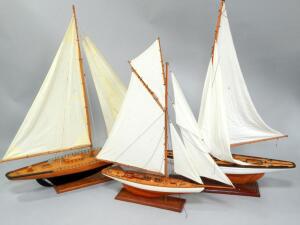 Three model sailing boats