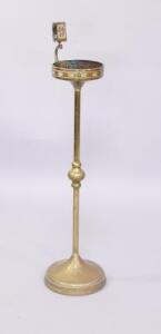 An Art Nouveau brass smoker's stand