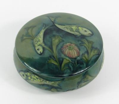 A Moorcroft pottery powder box and cover