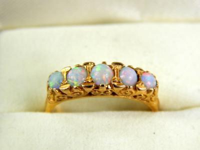 An opal five stone dress ring