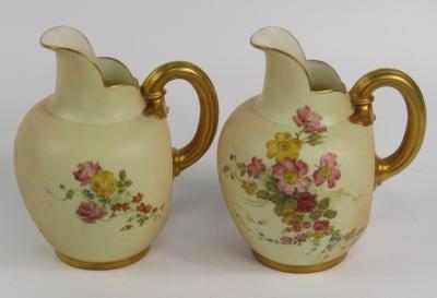 A pair of Royal Worcester blush porcelain jugs