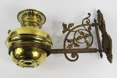 A Victorian brass wall mounted oil lamp