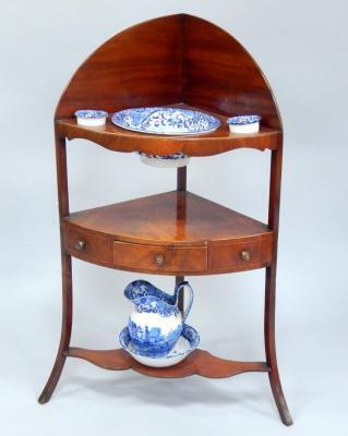 A George III mahogany corner washstand