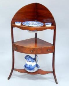 A George III mahogany corner washstand