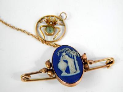 A Victorian yellow metal and Wedgwood mourning dark blue Jasper bar brooch