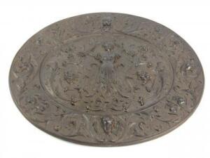 A Victorian cast iron oval wall plaque