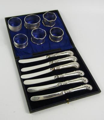 A set of six George V pistol handled cake knives