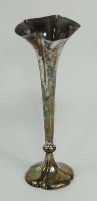 A loaded silver bud vase
