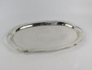 A twin handled and white metal tray