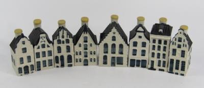 A set of eight delftware Bols liqueur bottles