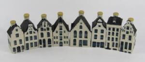 A set of eight delftware Bols liqueur bottles