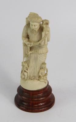 An Indian ivory carving of a musician
