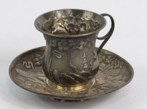 A Chinese white metal coffee cup and saucer