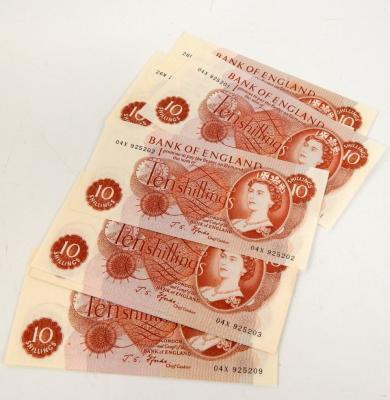 Twelve mint uncirculated ten shilling notes
